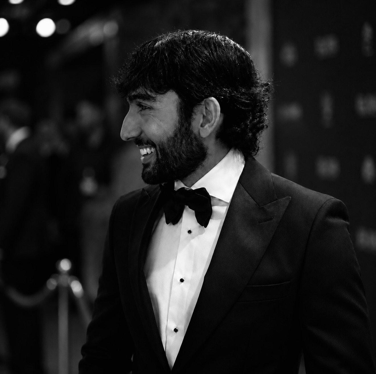 Akam Hamak in a black suit